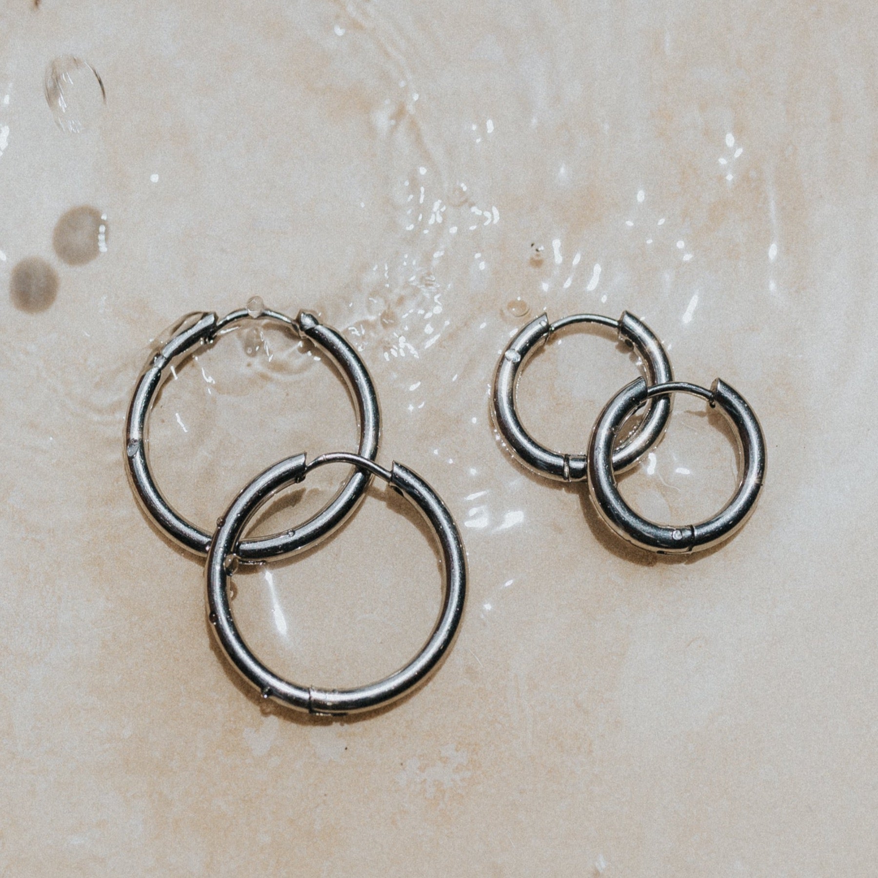 Silver Surf earrings waterproof anti rust hoops by lore of the sea
