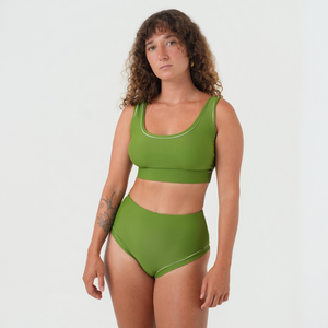 Woman wearing a green bikini set 