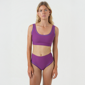 Woman wearing a purple bikini set 