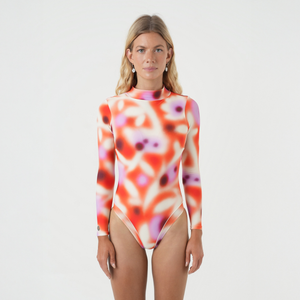 Woman wearing a floral surfsuit