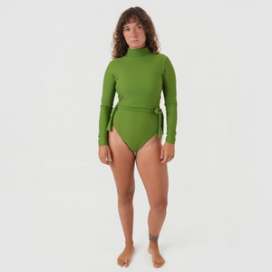 woman wearing one piece and crop top green