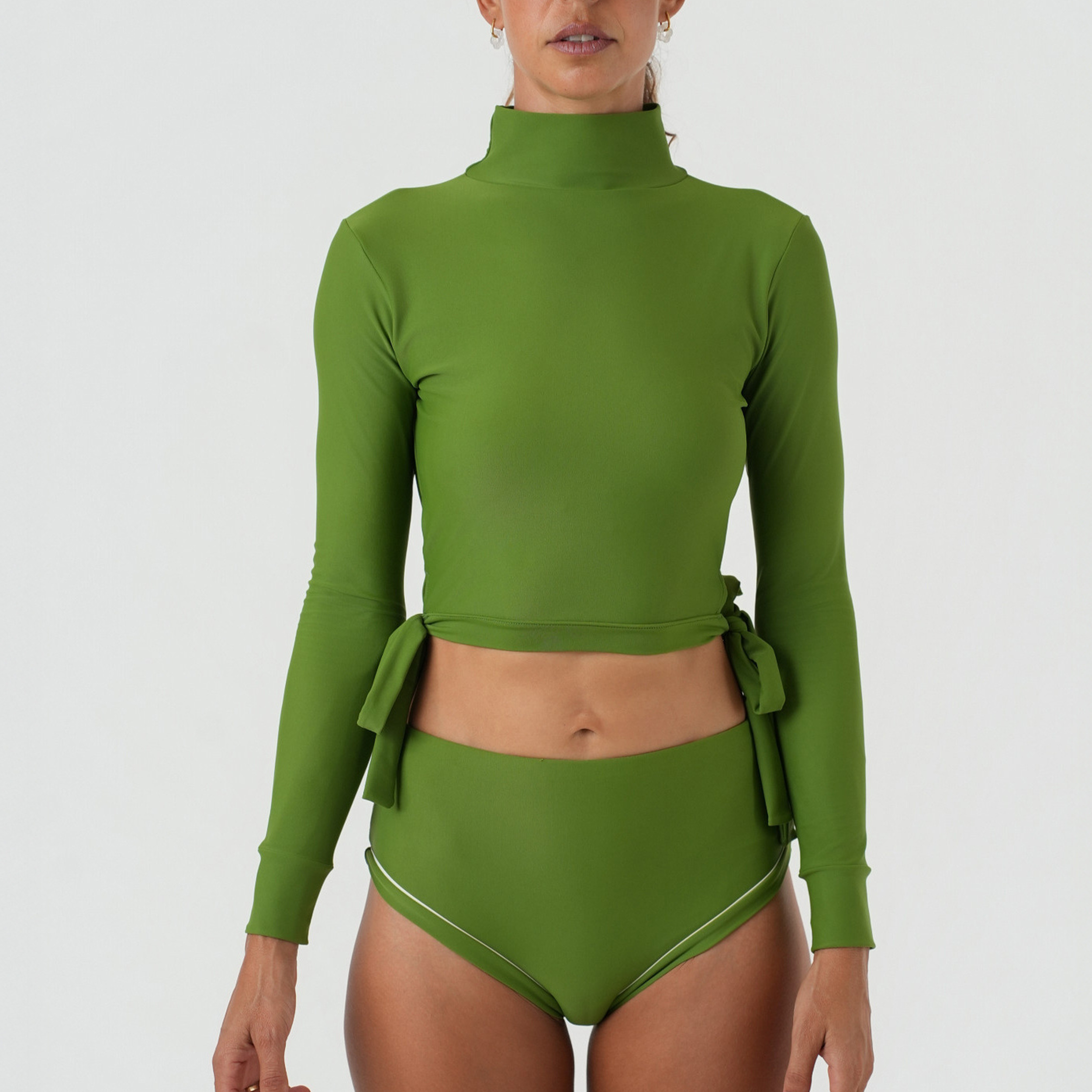 Green swimsuit with long sleeves and high-waisted bottoms 