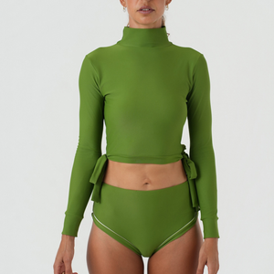 Green swimsuit with long sleeves and high-waisted bottoms 