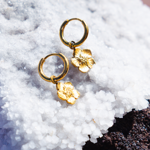 gold waterproof hibiscus earrings lore of the sea 