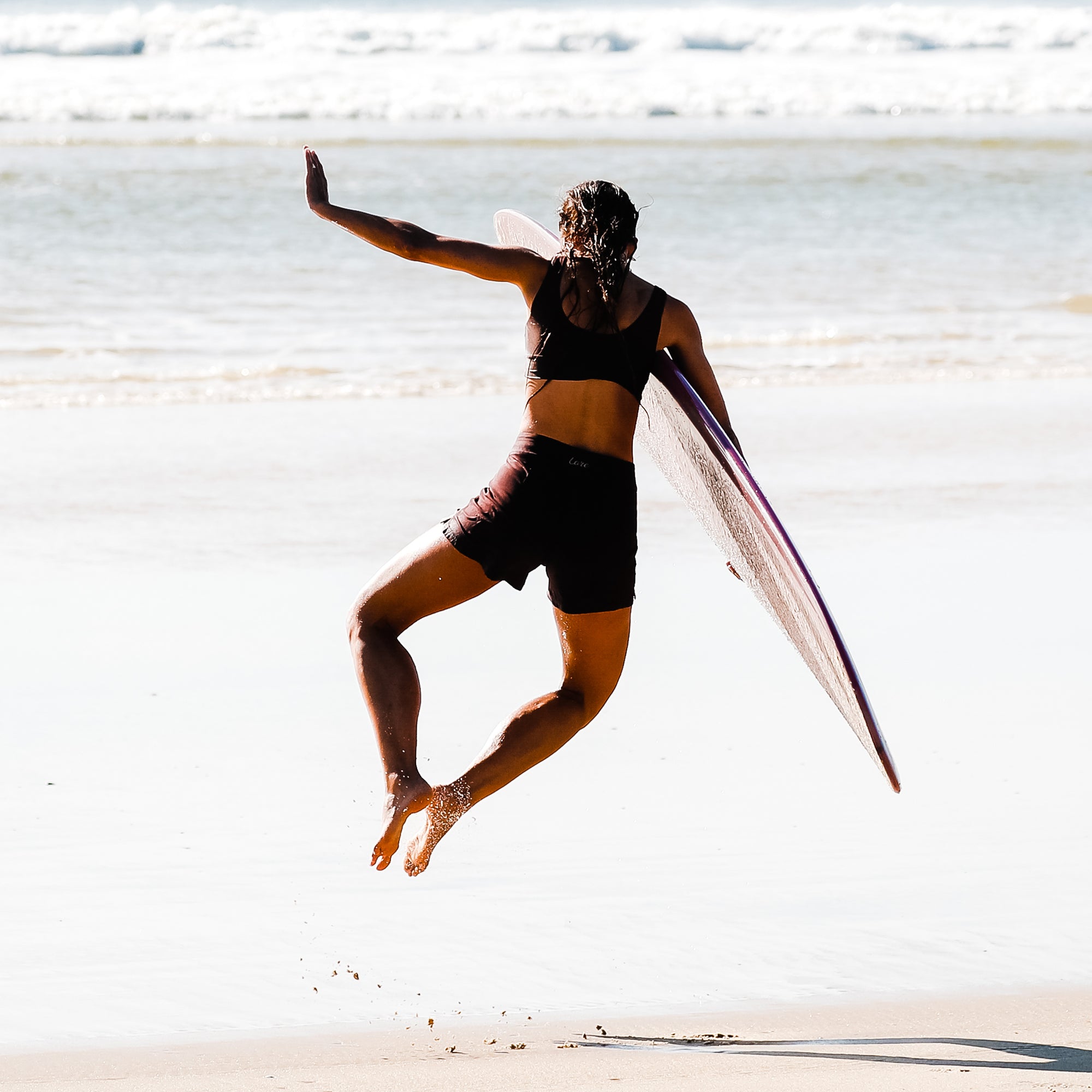 surfer girl wearing women boardshorts Lore of the Sea