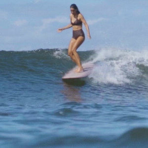 Surfer girl in brown bikini Lore of the Sea