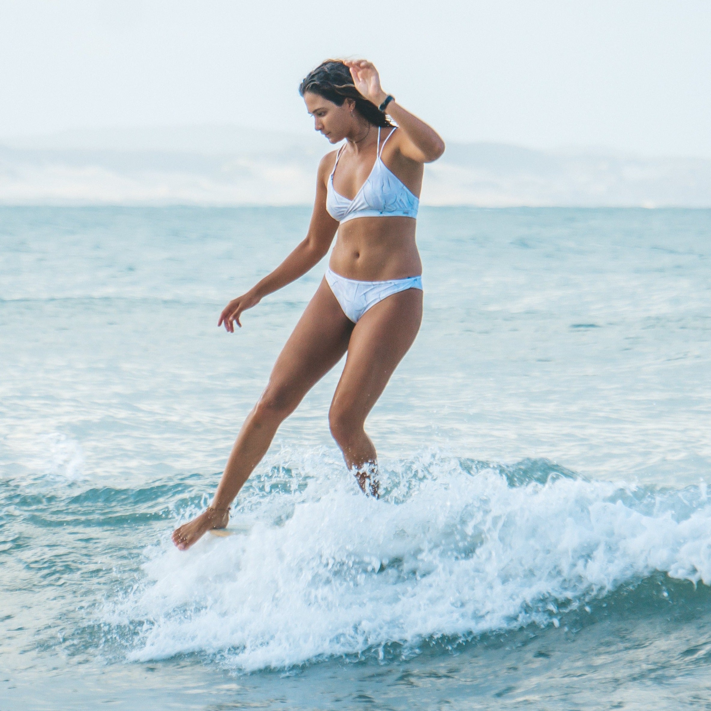 surfer girls lilac bikini noseriding lore of the sea