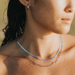 surfer wearing Waterproof necklaces silver jewellery lore of the sea