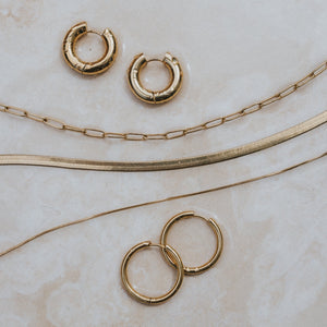 waterproof surf jewellery gold earrings and necklace by lore of the sea